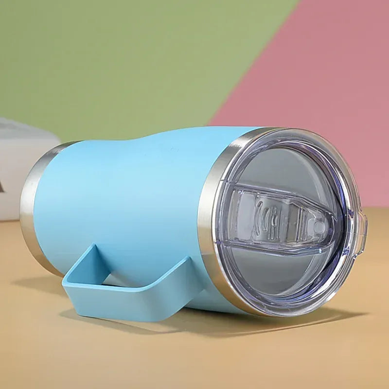 Blue tumbler with a clear lid on a colorful background