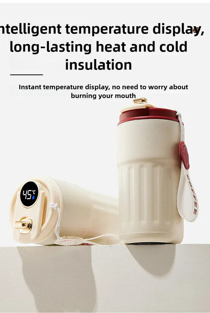 Heated water bottle with digital temperature display on a white background