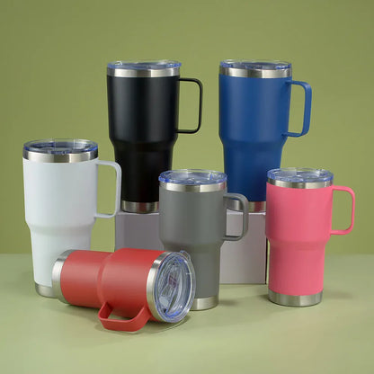 Set of colorful insulated travel mugs on a green background