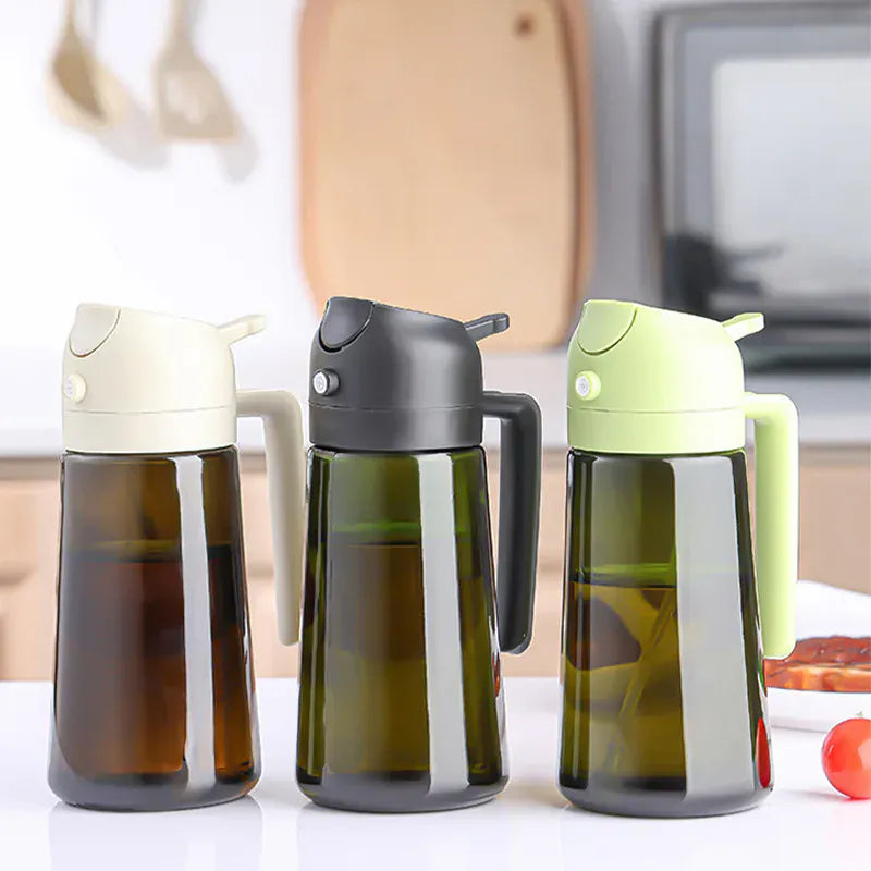 Three olive oil bottles with different colored lids on a kitchen counter.