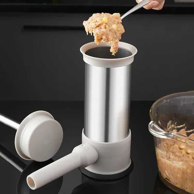 Manual meat grinder in use with ground meat on a black background