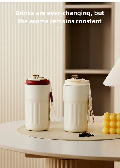 Two white ceramic tumblers on a table with text about drink aromas.