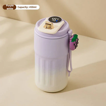 Purple and white thermos with digital temperature display on a beige background