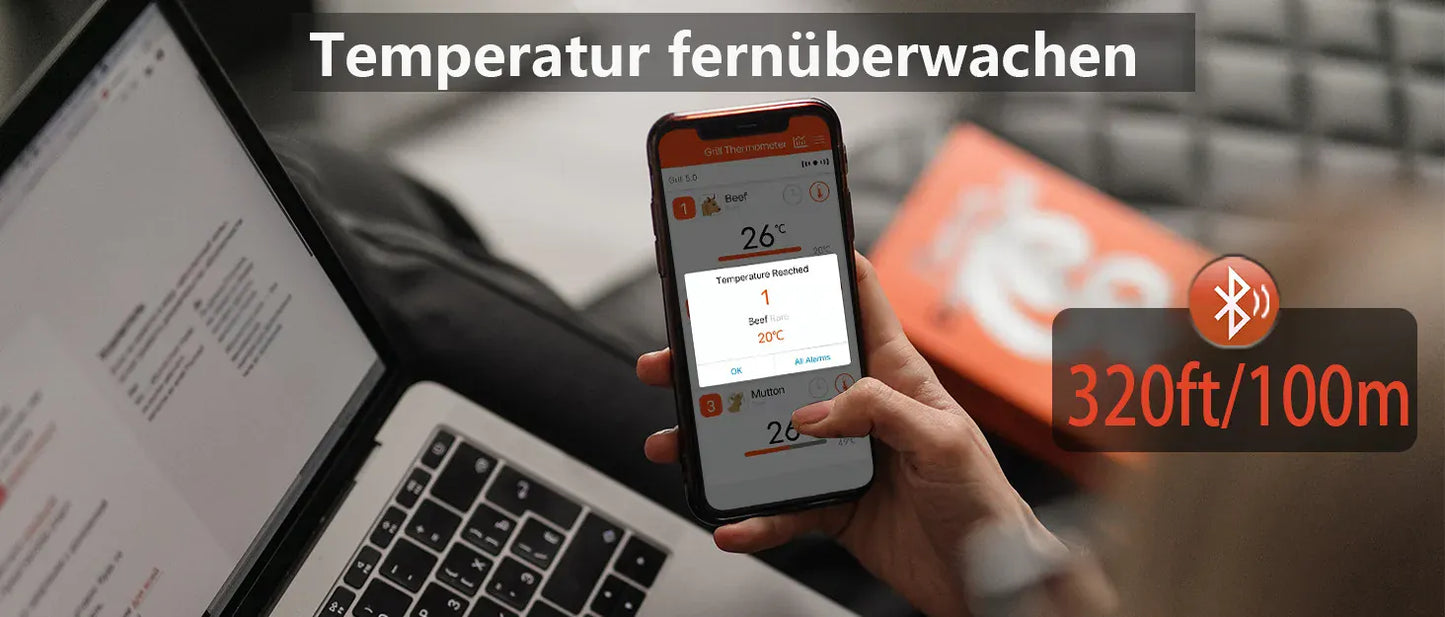 Person holding a smartphone with a temperature monitoring app, next to a laptop, with text about temperature monitoring range.