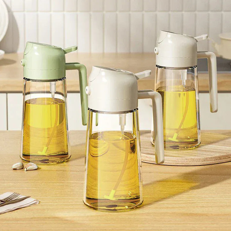 Three glass oil dispensers with different colored lids on a wooden surface.
