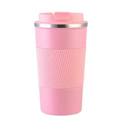 Pink travel mug with a ribbed texture on a white background
