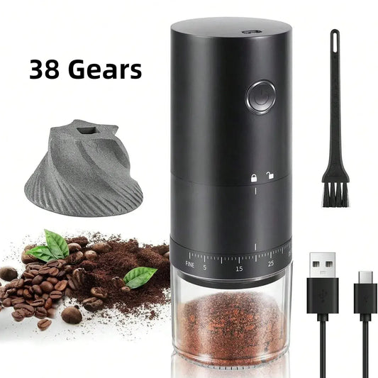 Black coffee grinder with accessories on a white background