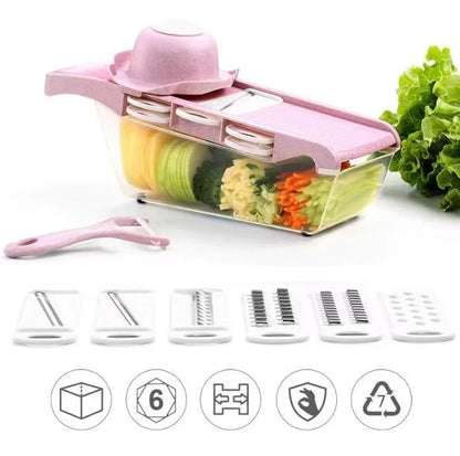 Pink vegetable chopper with various blades and vegetables on a white background