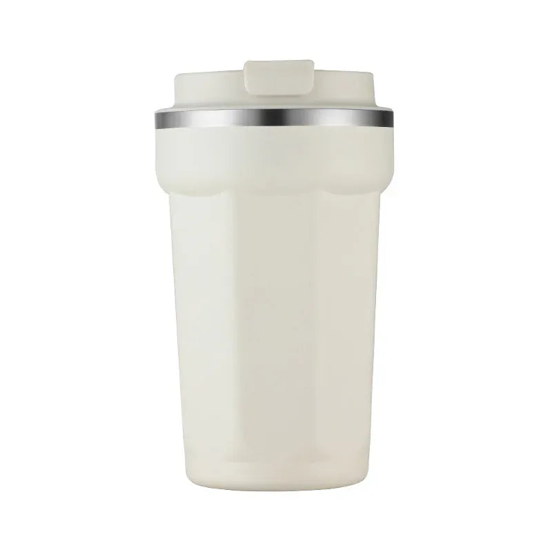 White tumbler with a silver rim on a white background