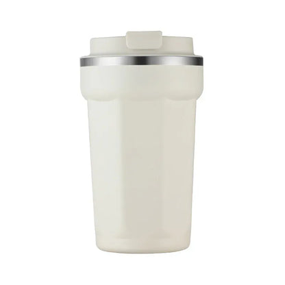 White tumbler with a silver rim on a white background