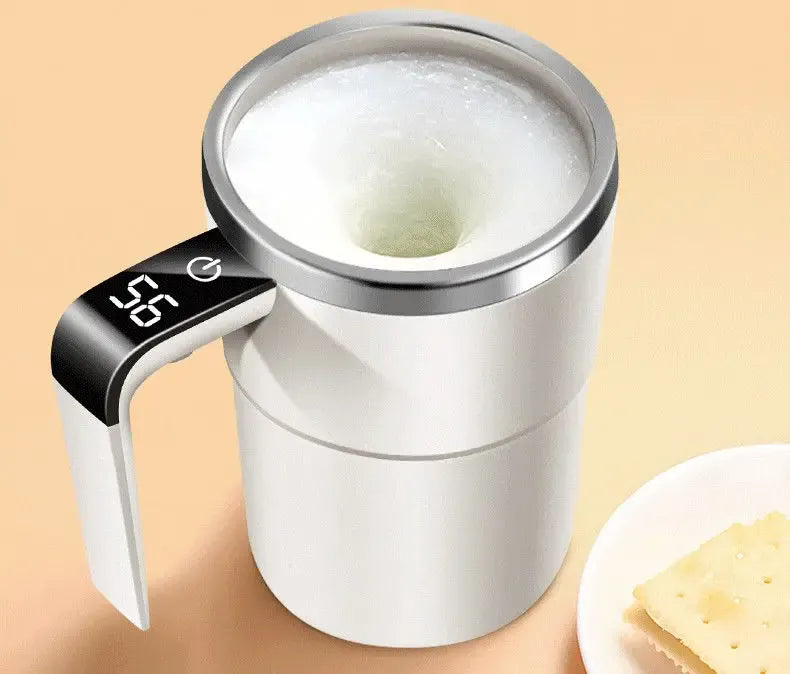 Electric milk frother with digital display on a beige background