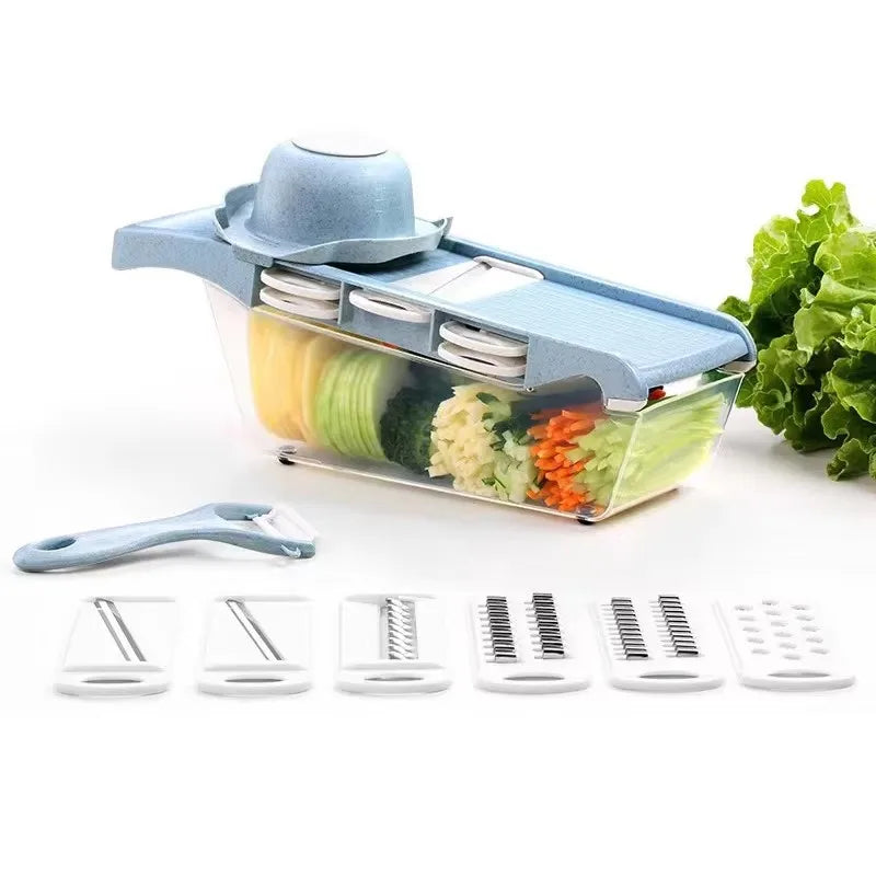 Vegetable chopper with various attachments and sliced vegetables on a white background