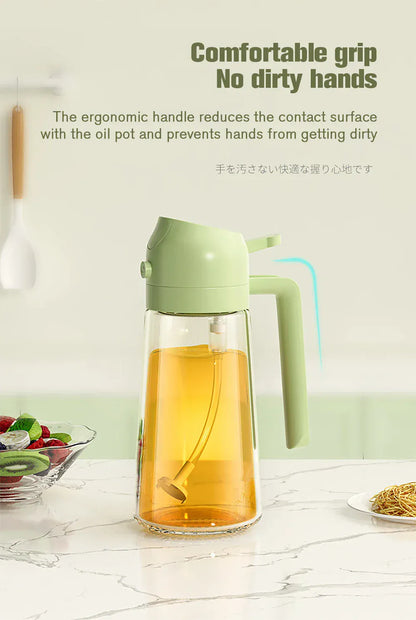Green oil dispenser with a clear container filled with oil on a white surface.