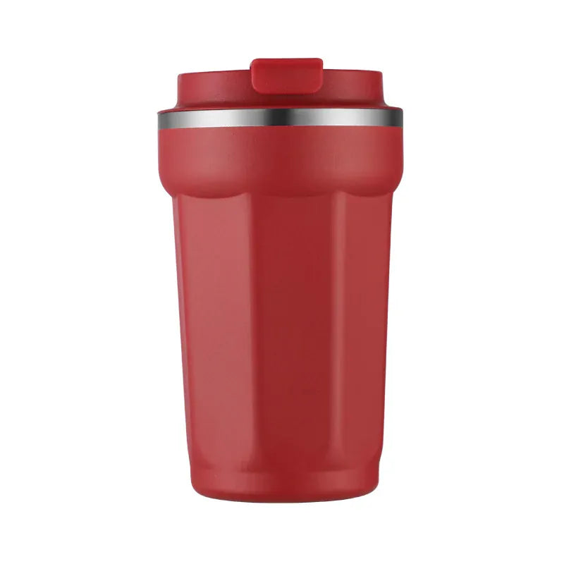 Red insulated tumbler with a silver rim on a white background