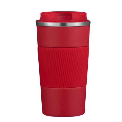 Red travel mug with a silver rim on a white background