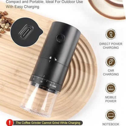 Black coffee grinder on a wooden surface with charging options displayed.