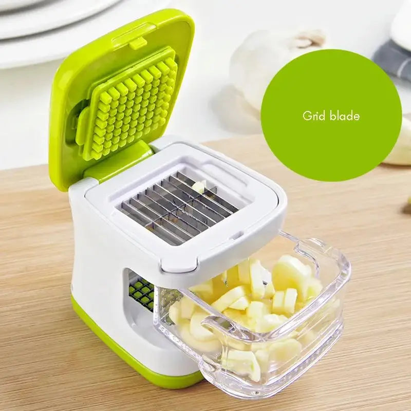Green and white vegetable chopper with grid blade on a wooden surface