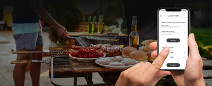 Person using a smartphone app at an outdoor gathering with food and drinks.