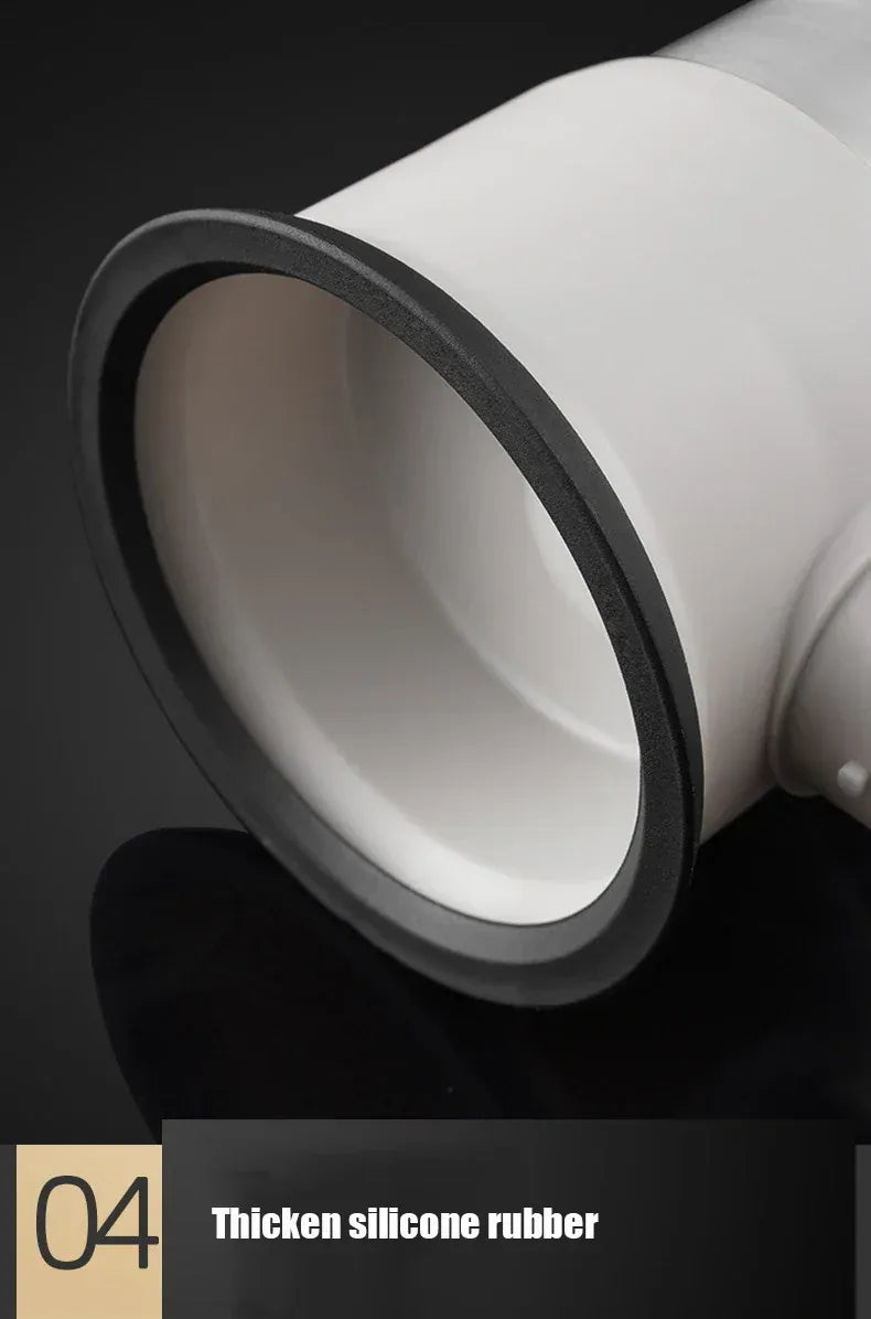 Close-up of a white silicone rubber product with black rim on a dark background