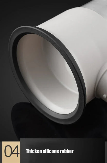 Close-up of a white silicone rubber product with black rim on a dark background