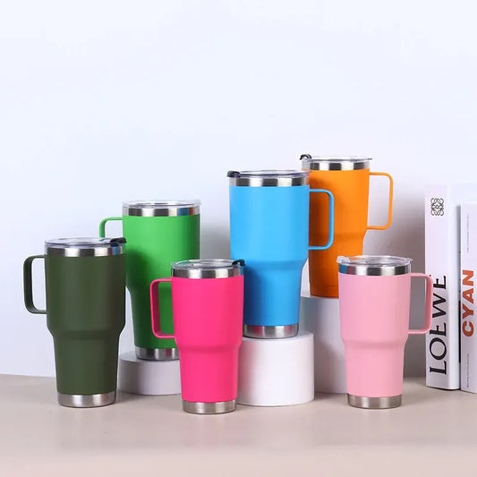Set of colorful travel mugs with metal handles on a white background