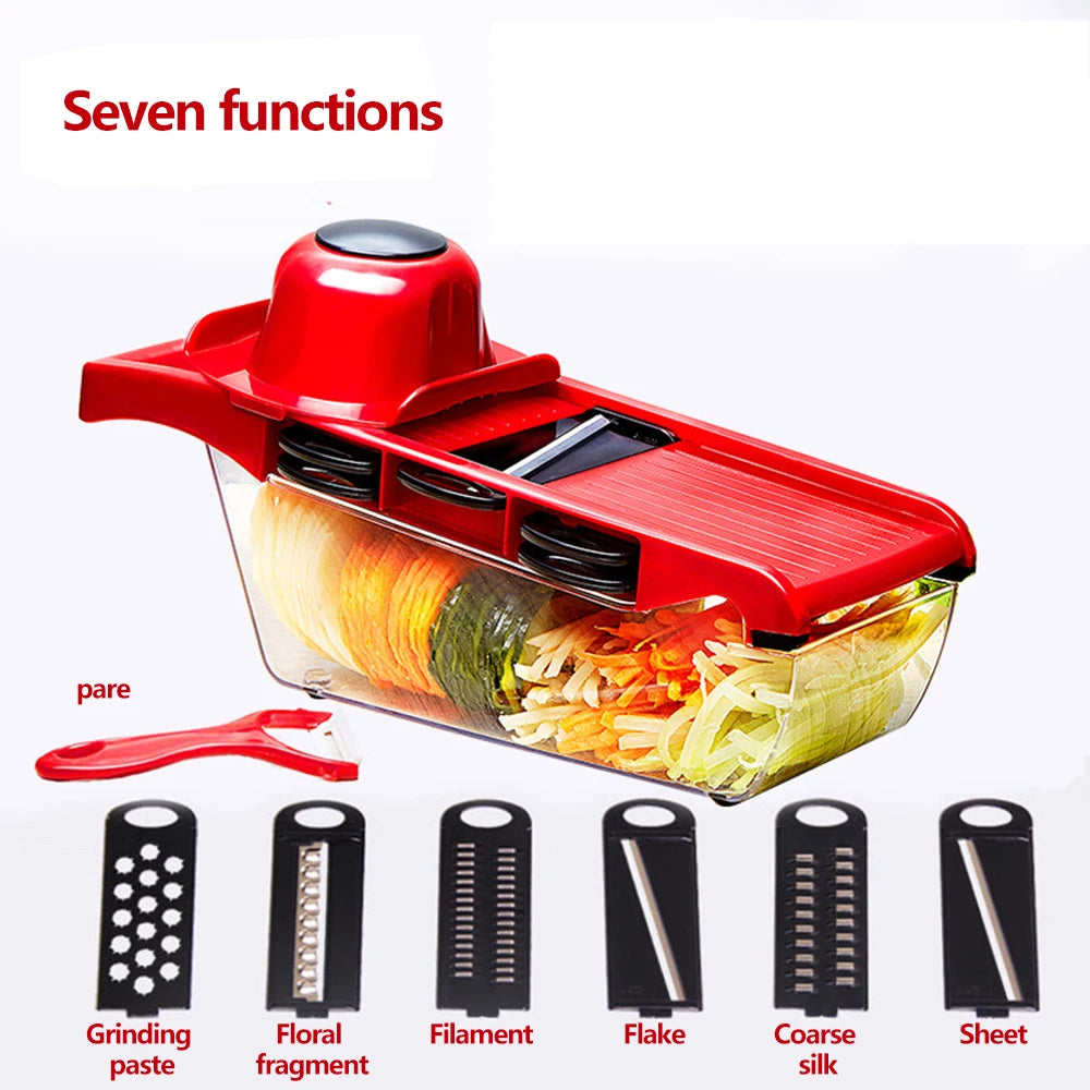 Red vegetable chopper with multiple attachments and sliced vegetables on a white background