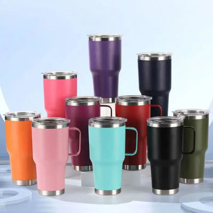 Collection of colorful insulated travel mugs with metal lids on a light blue background