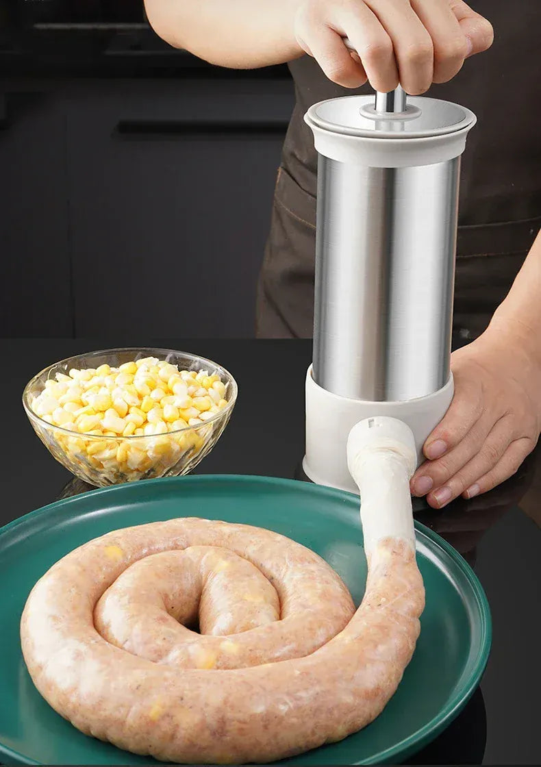 Person using a sausage stuffer with a sausage and corn on a plate