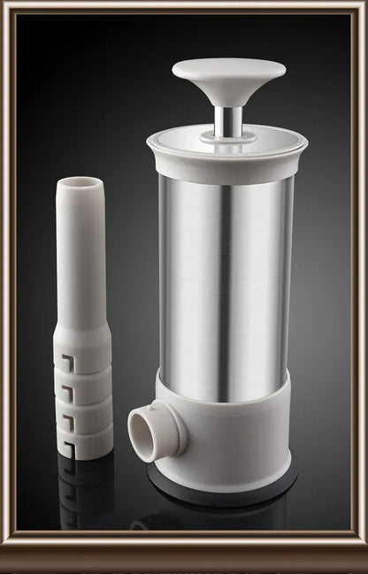 White and silver kitchen tool on a reflective black surface